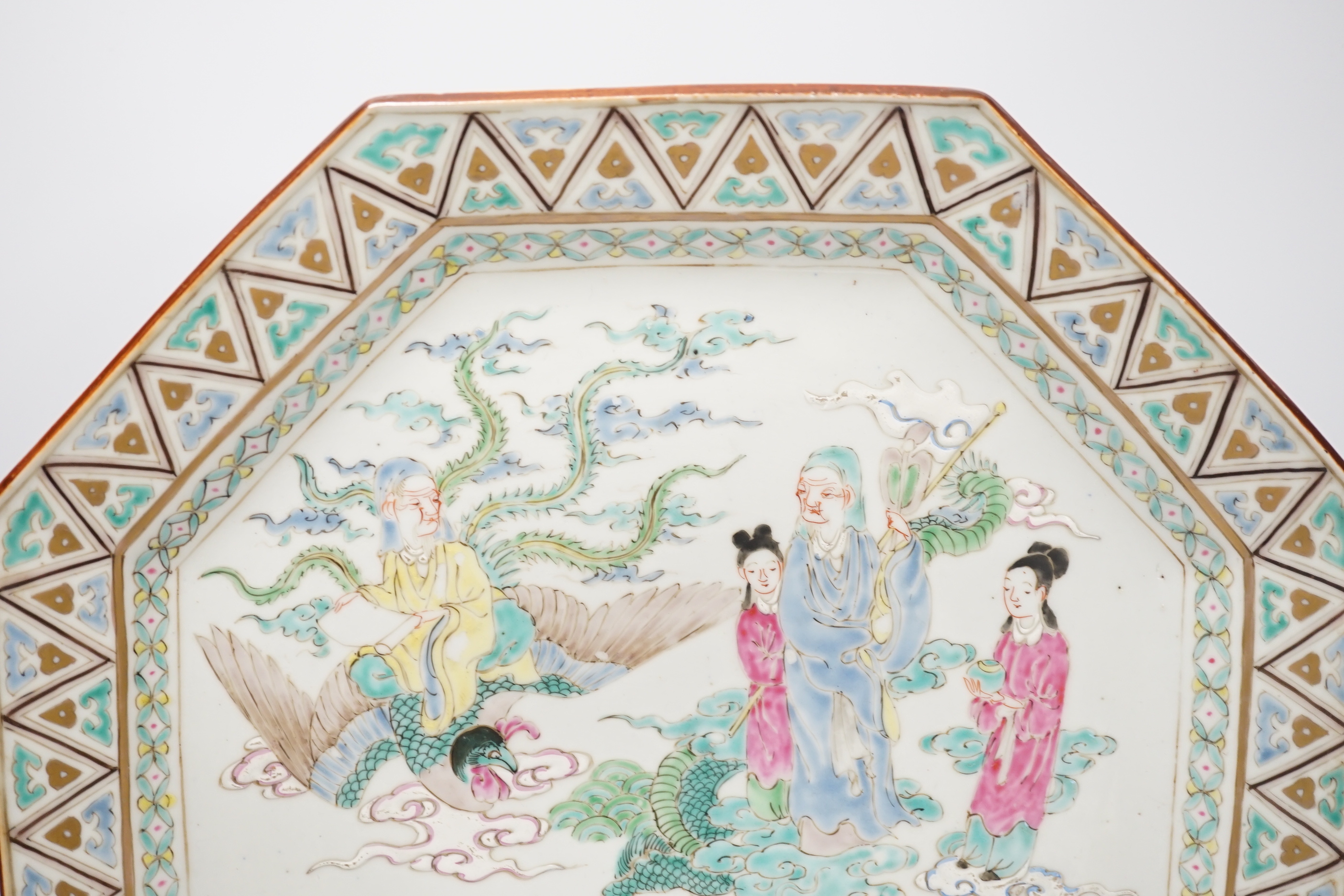 A Japanese porcelain octagonal dish enamelled with figures, dragon and bird, Meiji period, 36cm high